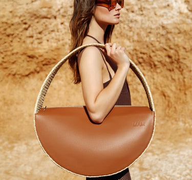 Bolso grande redondo de rafia