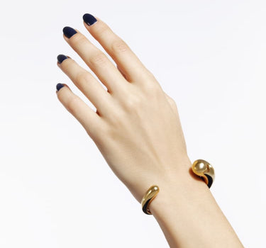 Brazalete rígido tipo torque de oro
