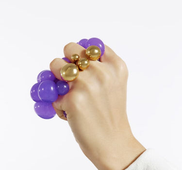 Anillo de oro con tres esferas